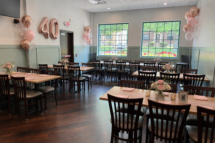 Party room with several tables with a casual feel.